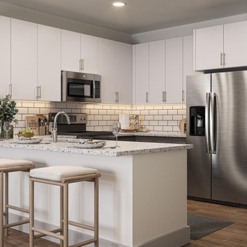 a kitchen with white cabinets