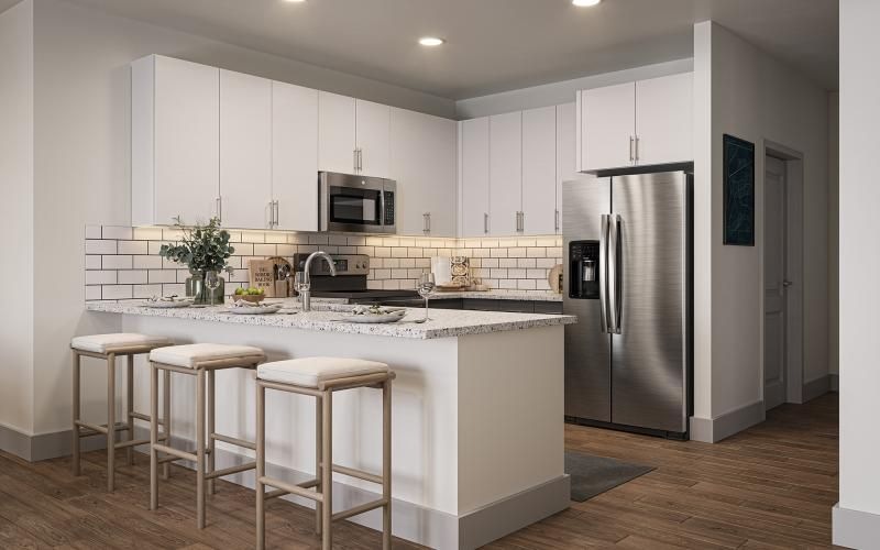 a kitchen with white cabinets