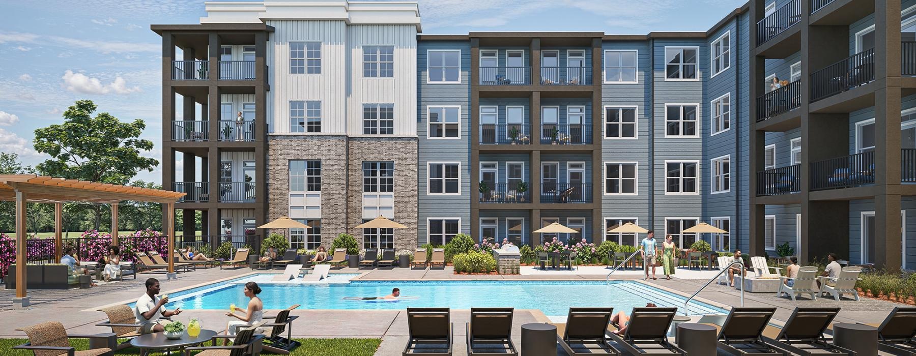 a pool with chairs and tables by a building